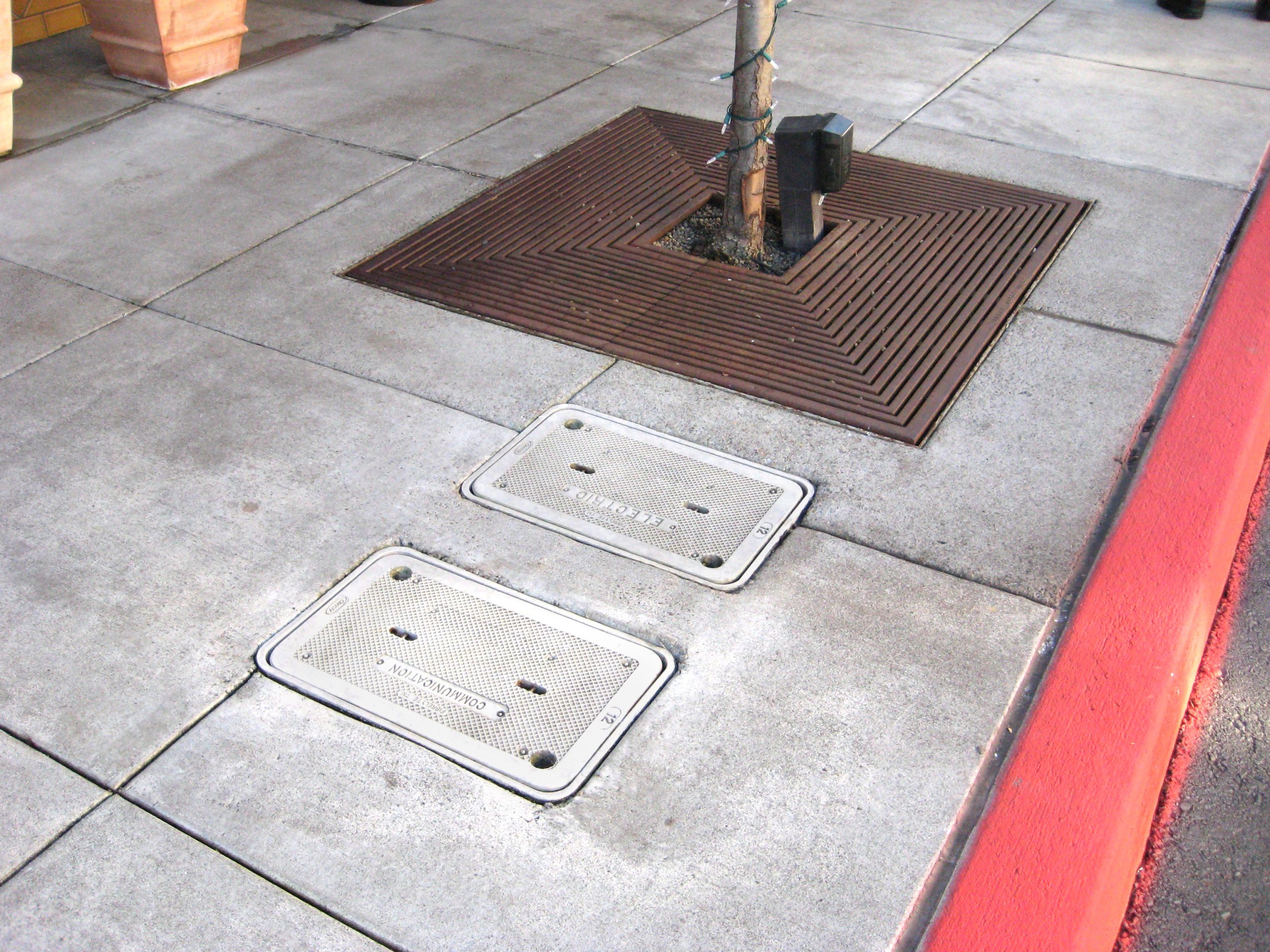 Anti-Float Enclosure Lids: The Unsung Utility Hero 2 Oldcastle Infrastructure Enclosure - Fibrelyte - Electric C&I Communication - Concrete Sidewalk