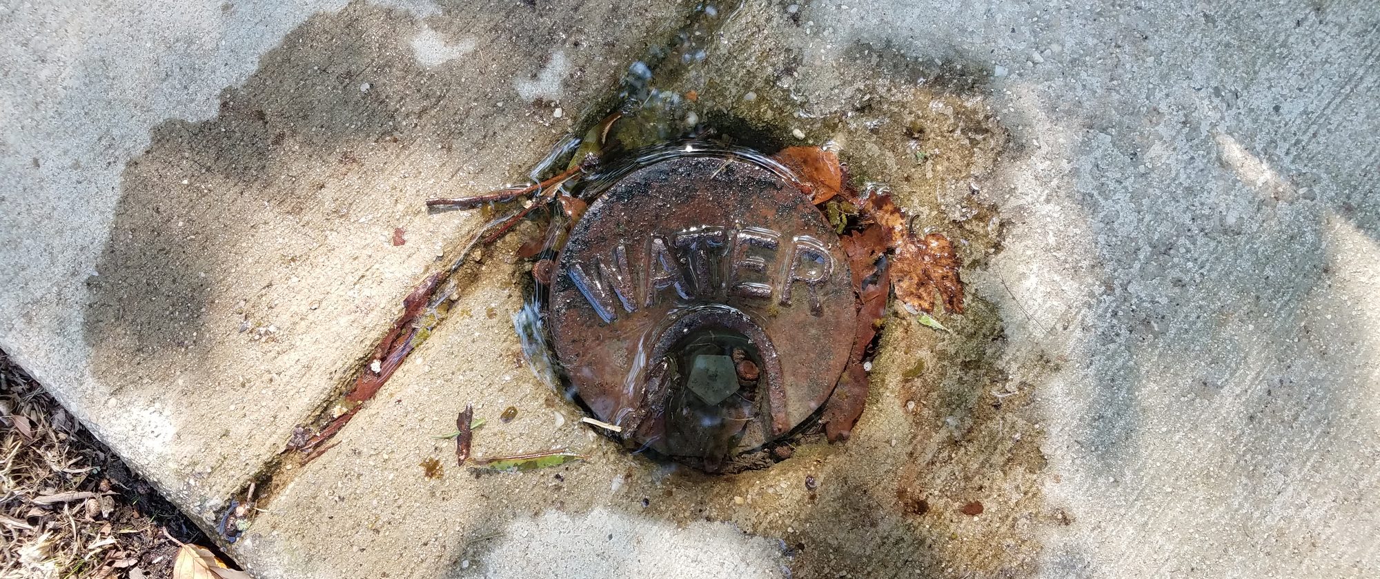 An image of a leak at a water utility access point of the kind that would be addressed by a drought resilience program